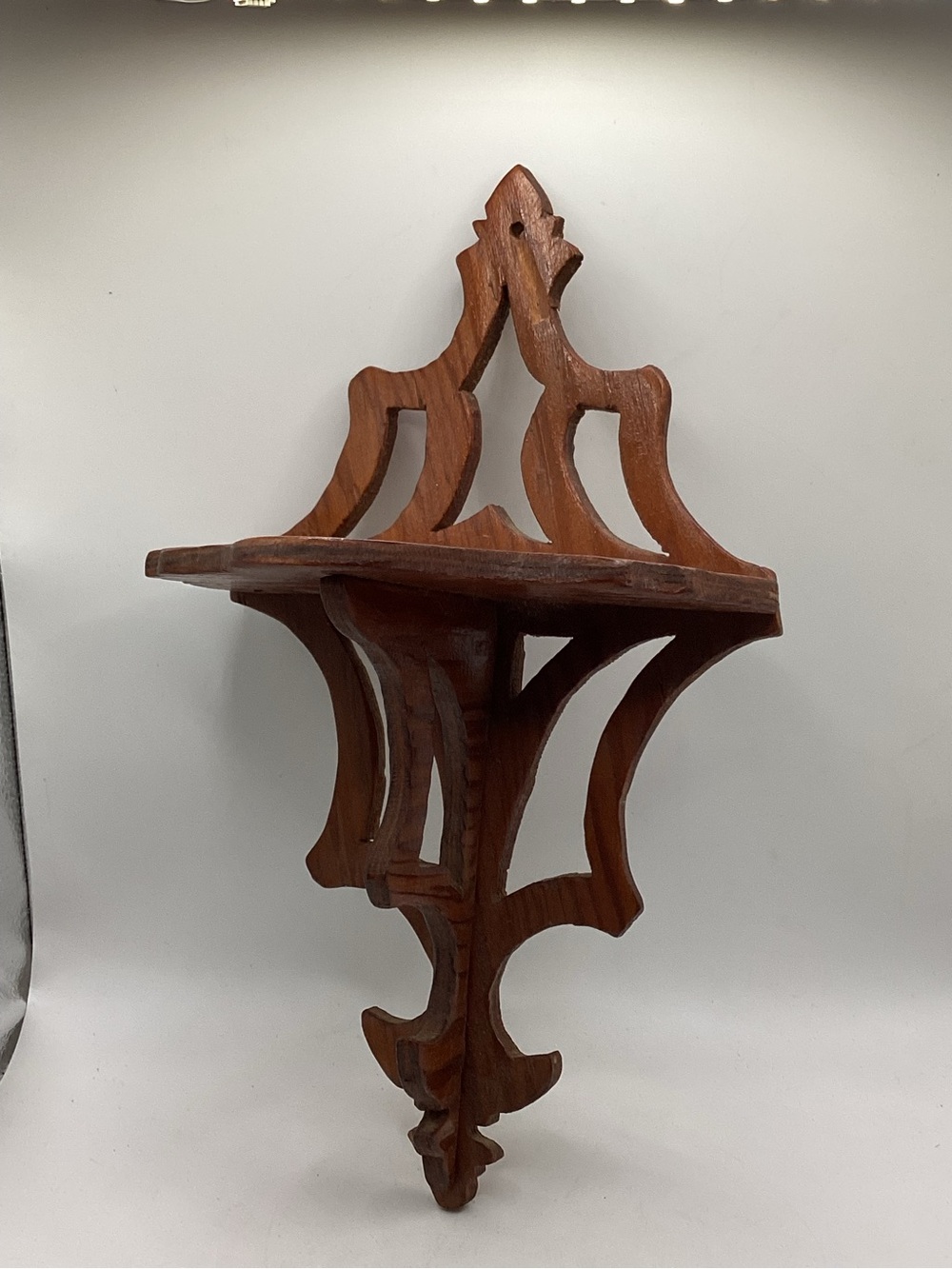 vintage hand-carved wooden wall shelf scrollwork